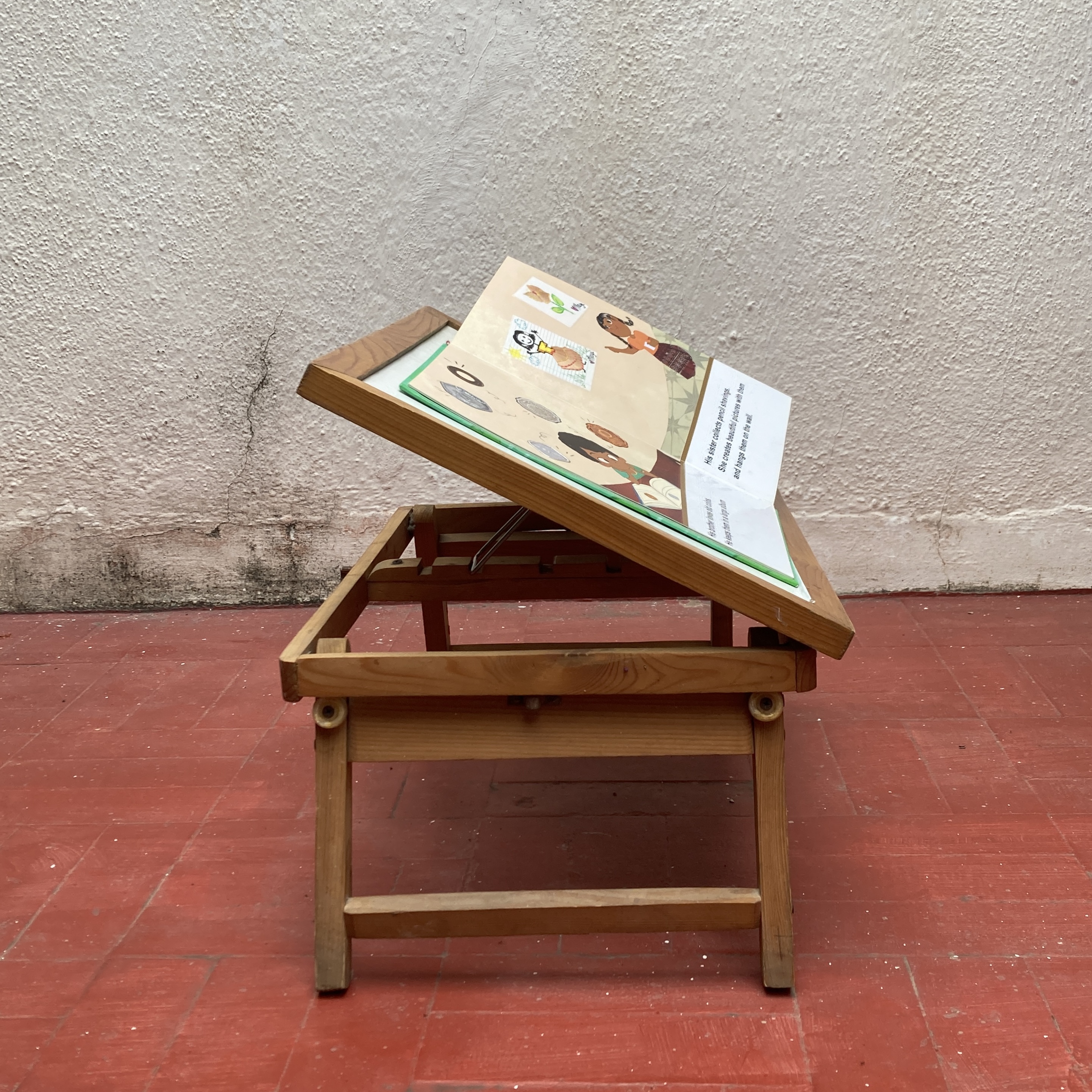 A clantboard to hold a book.